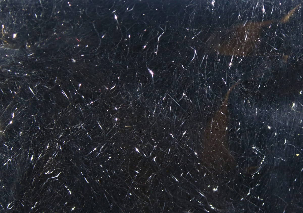 Black Hareline Ripple Ice Dub fly tying dubbing with fine iridescent synthetic fibers and sparkling silver highlights