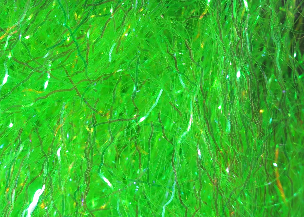 Bright lime-green Hareline Ripple Ice synthetic fiber with wavy iridescent strands for fly tying
