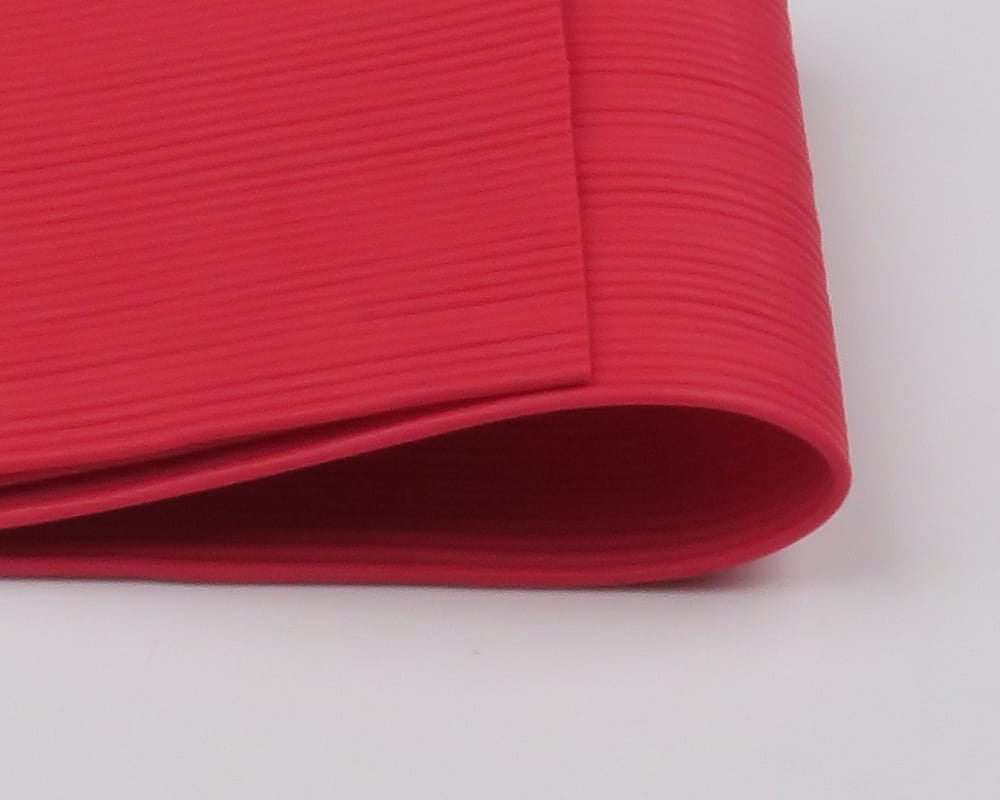 Hareline bright red ribbed rubber legs rolled strip, round elastic tubing for fly tying