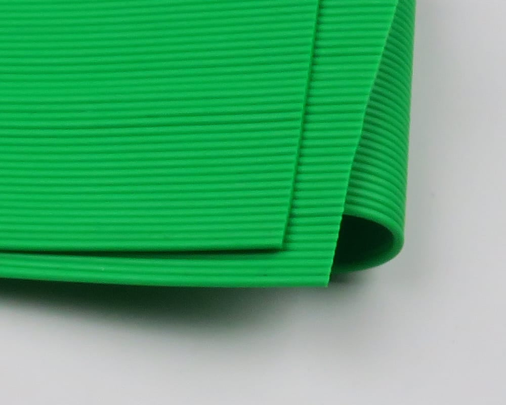 Bright green ribbed round rubber legs folded, flexible silicone strip for fly tying
