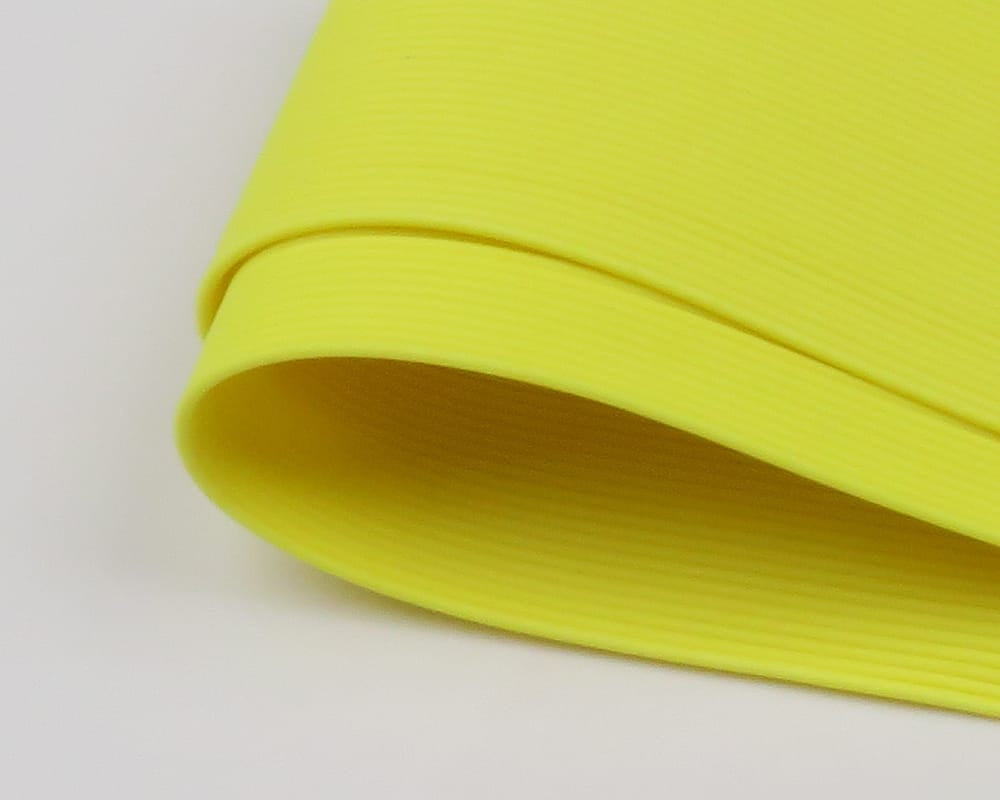 Chartreuse round rubber legs strip with fine ribbed texture, rolled rubber tubing for fly tying
