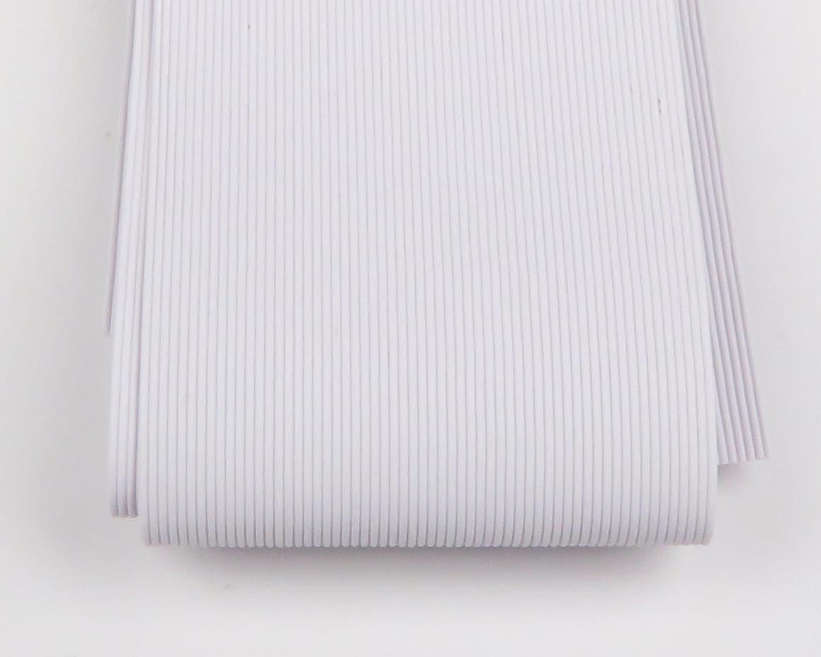 White Hareline round rubber legs, ribbed flexible strands bundled for fly tying