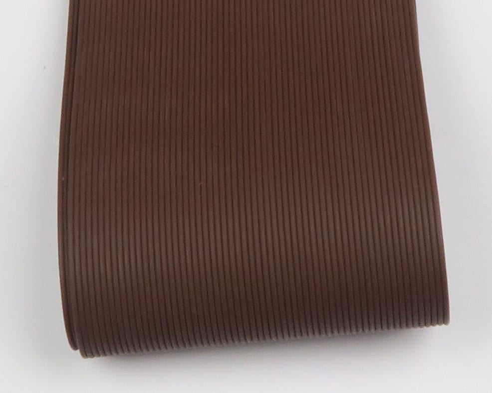 Rolled brown ribbed round rubber legs for fly tying, flexible synthetic strands with fine parallel ridges