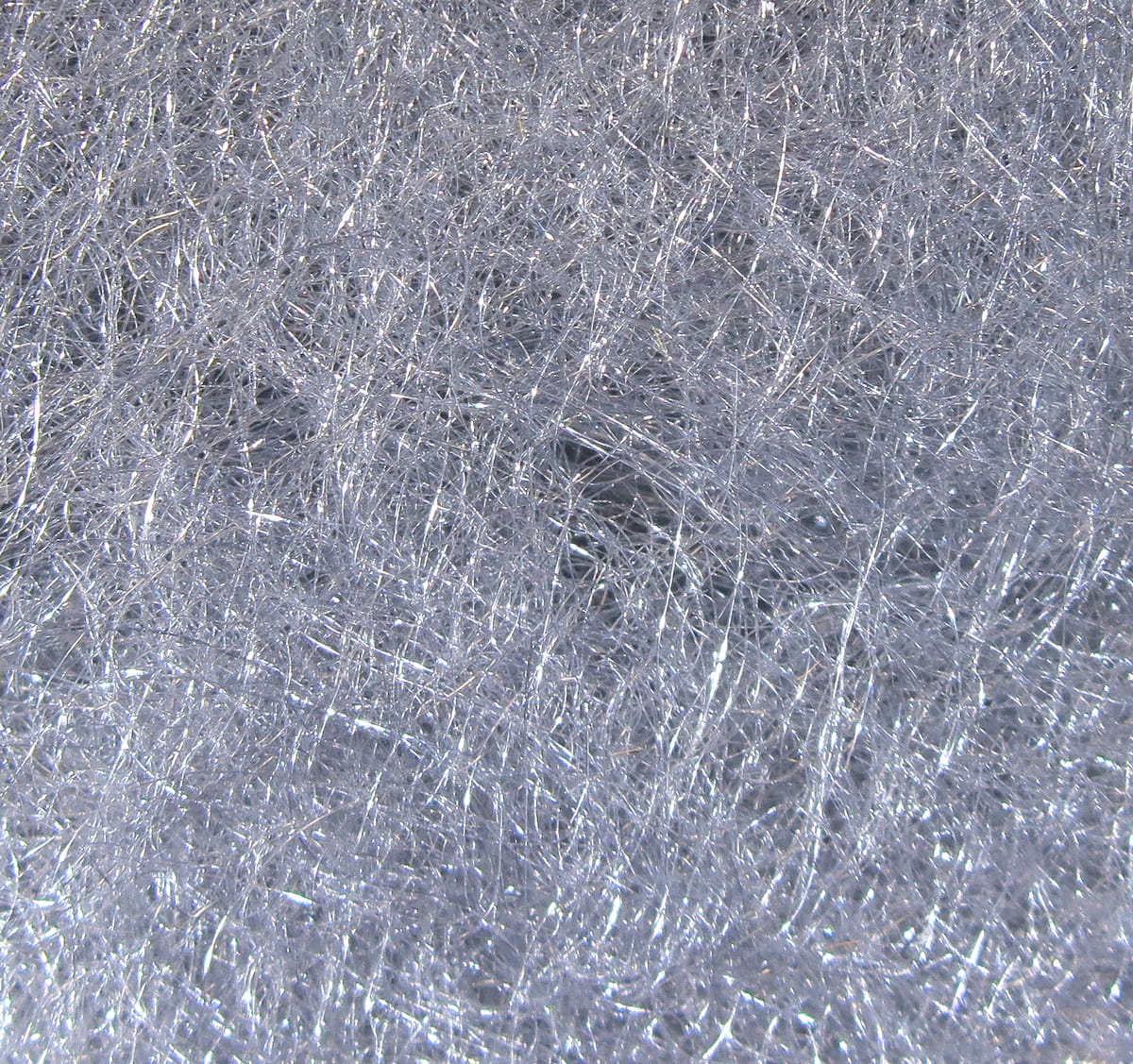 Silver translucent Hareline Scud Dub synthetic dubbing with fine sparkling fibers for fly tying