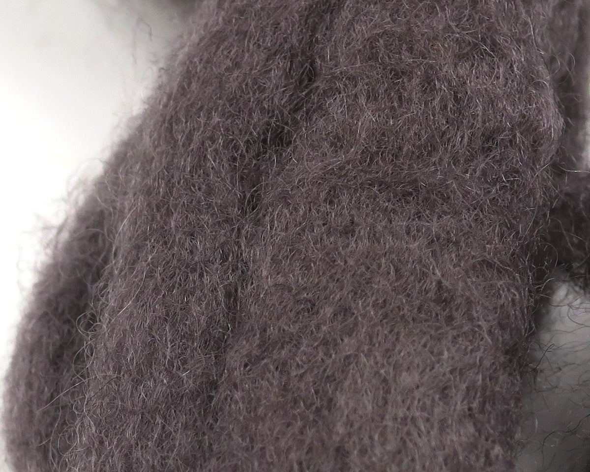 Dark brown-gray Hareline Sculpin Wool close-up showing fuzzy wispy fibers, soft textured fly-tying material