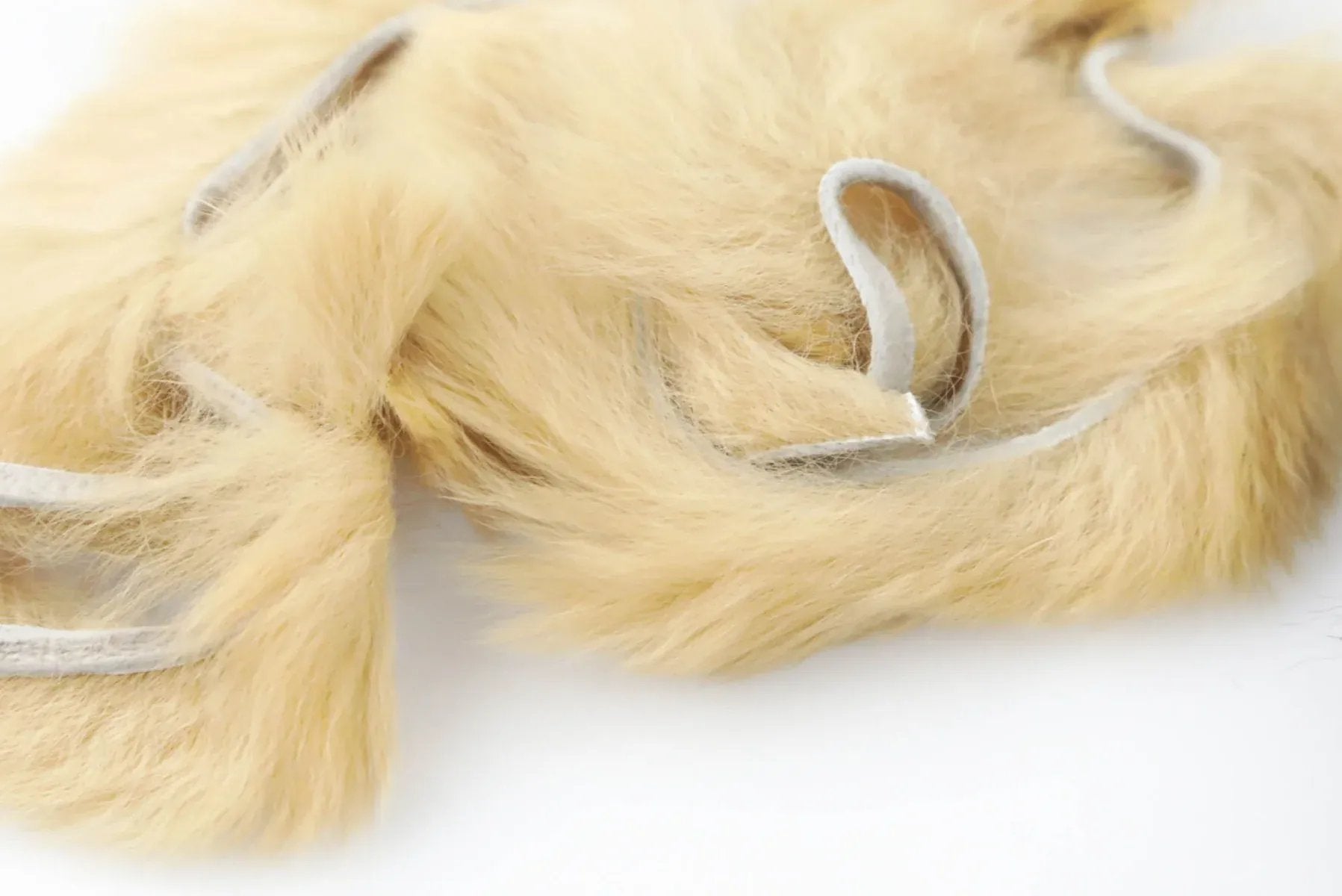 Cream tan silky bunny strips with soft fluffy rabbit fur and white fabric backing for fly tying