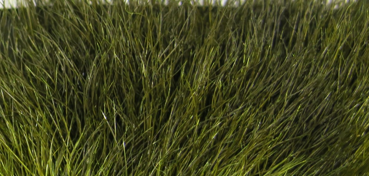 Olive green snowshoe rabbit fur clump with long soft guard hairs for fly tying