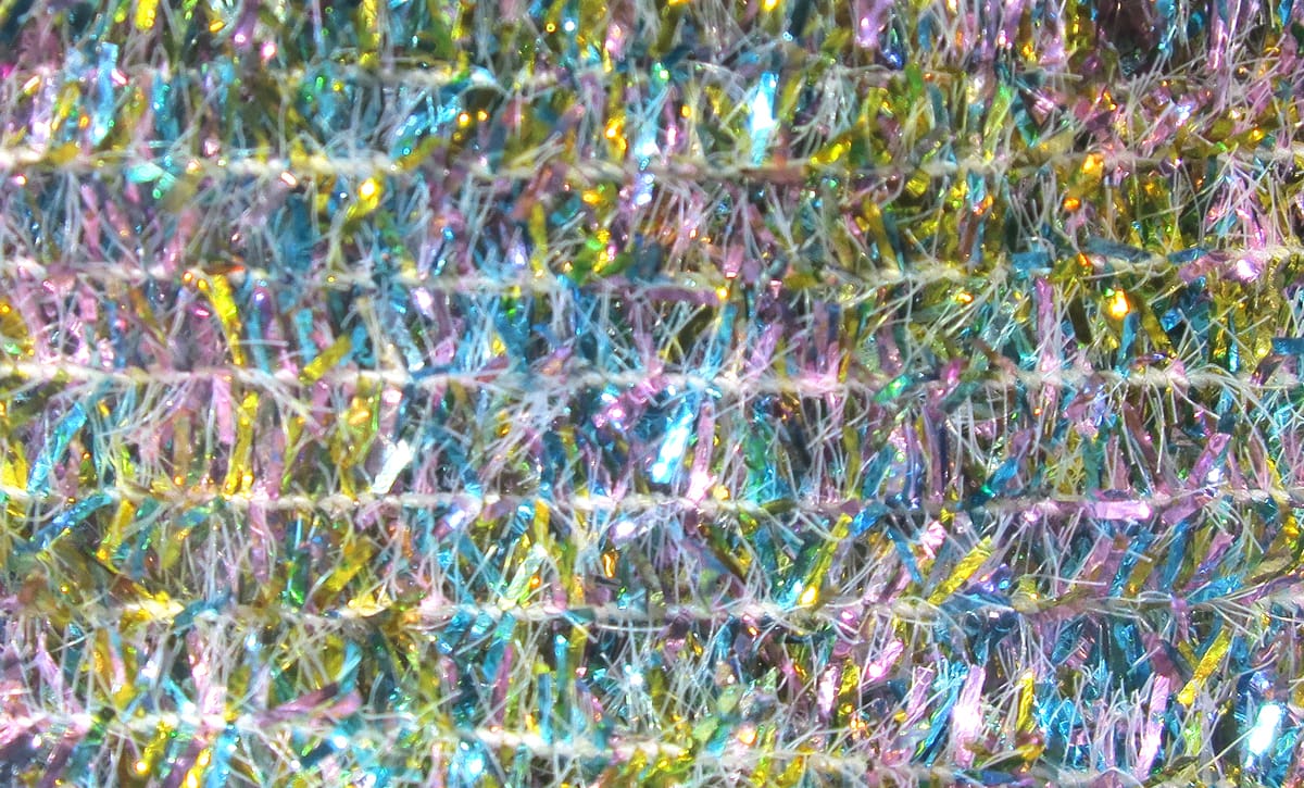 Multicolored tinsel chenille with iridescent metallic strands and fuzzy fiber core, sparkly fly tying material