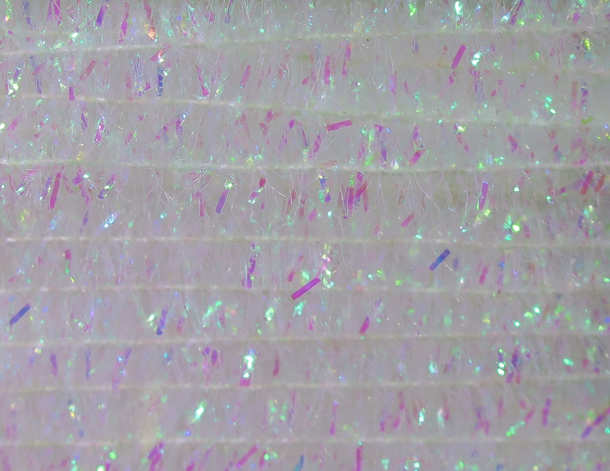Hareline solid tinsel chenille, pearlescent white fiber with pink and green iridescent tinsel strands for fly tying