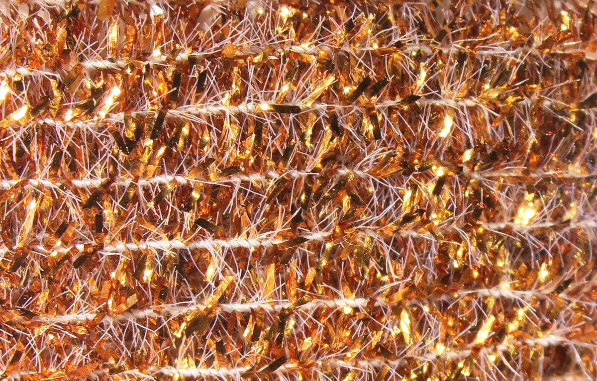 Copper-gold solid tinsel chenille with white core and metallic sparkle, fuzzy ribbed fly tying material