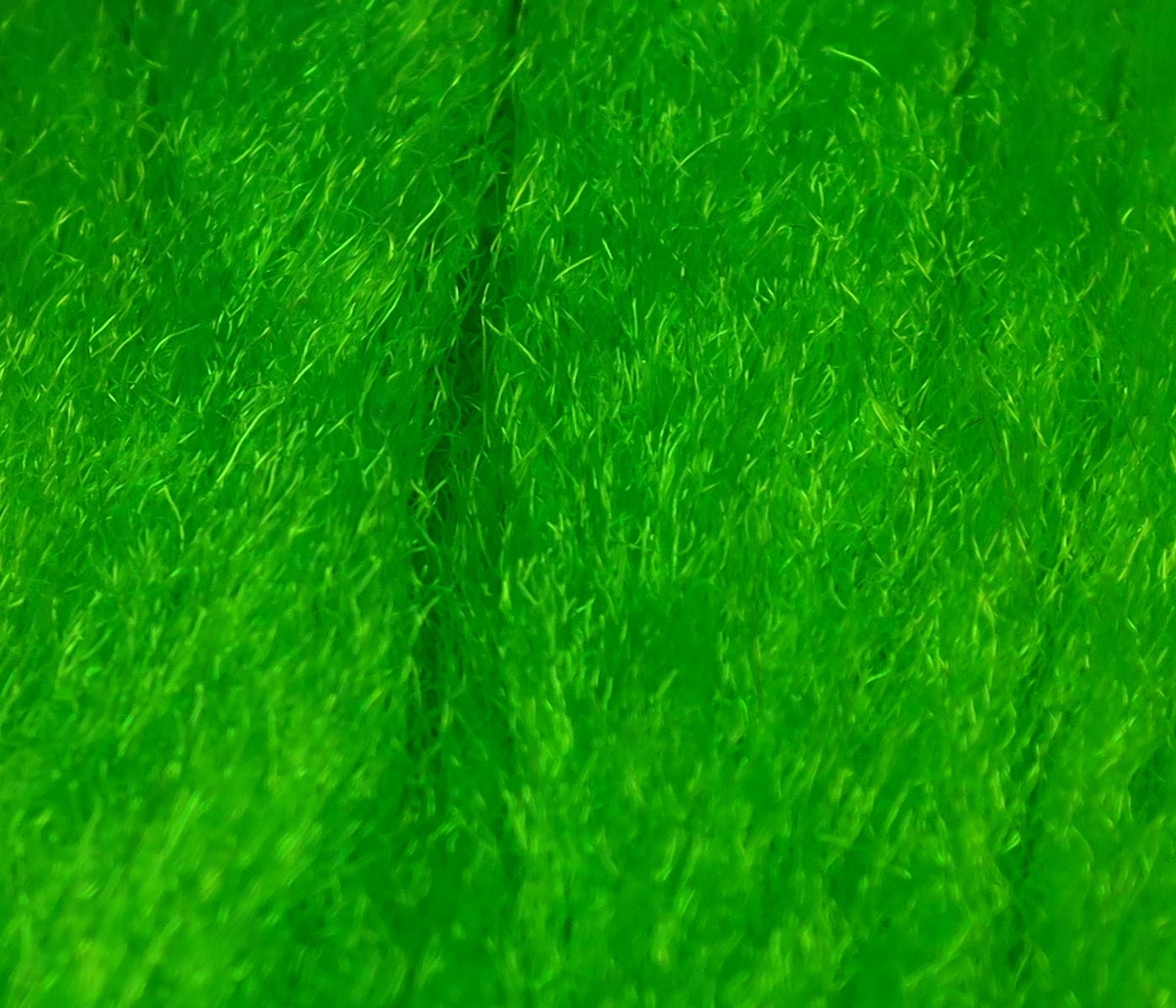 Bright neon green Hareline Sparkle emerger yarn for fly tying, fuzzy synthetic fibers with short halo and subtle shiny