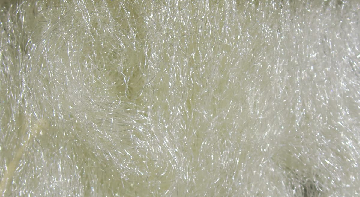 Cream Hareline Sparkle Emerger yarn with iridescent synthetic fibers and fine sparkling strands for fly tying