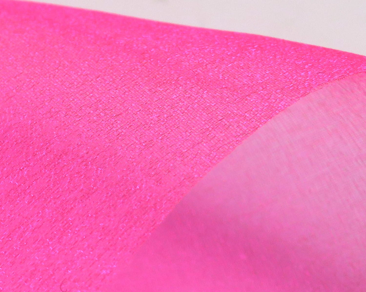 Hot pink sparkle organza fabric with shimmering texture and subtle translucence, ideal for fly tying