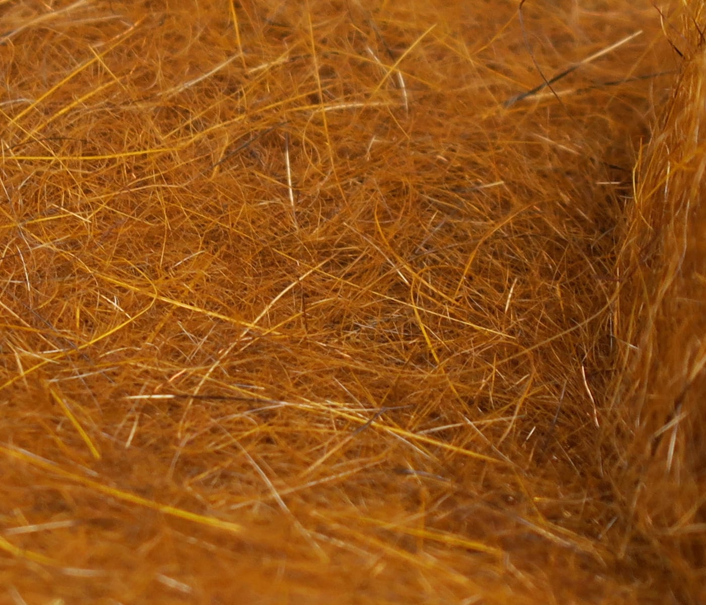 Hareline squirrel hair dubbing, orange-brown wispy natural fur with fine golden guard hairs for fly tying