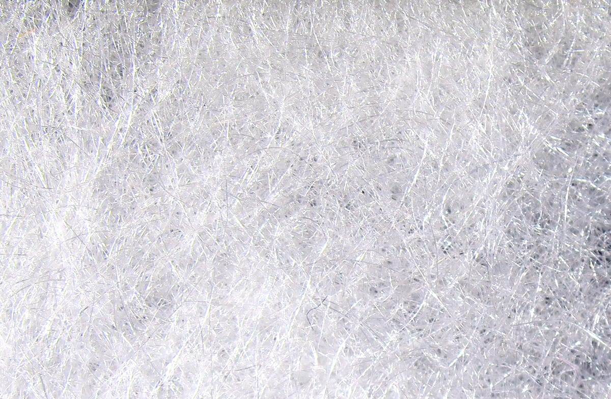 White Hareline STS trilobal synthetic dubbing fibers with silver sparkle, fluffy fly tying material