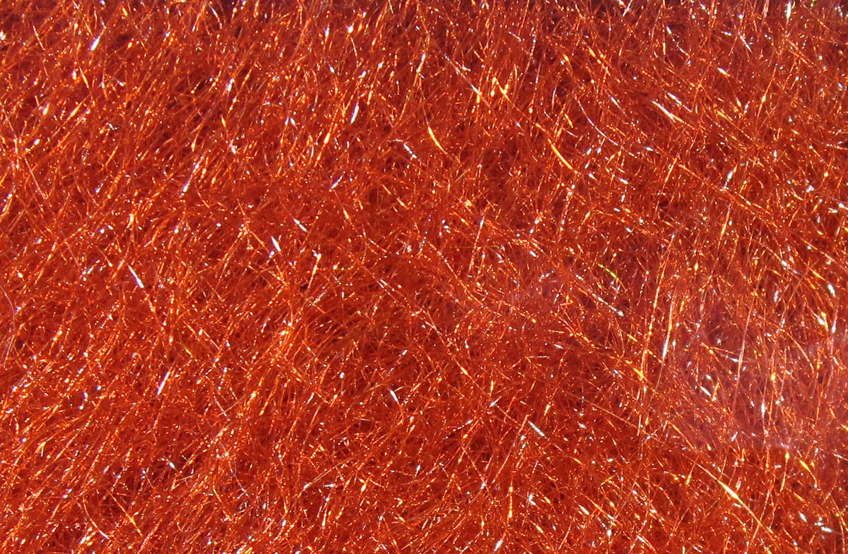 Copper-orange Hareline STS trilobal dubbing with fine sparkly synthetic fibers for fly tying