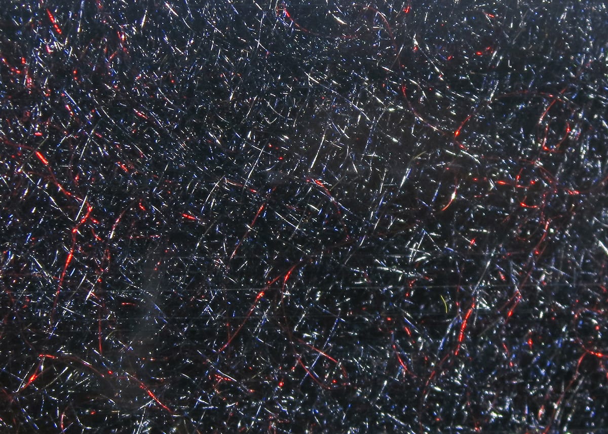 Black Hareline STS trilobal dubbing with red and silver flash fibers, shiny synthetic fly tying material
