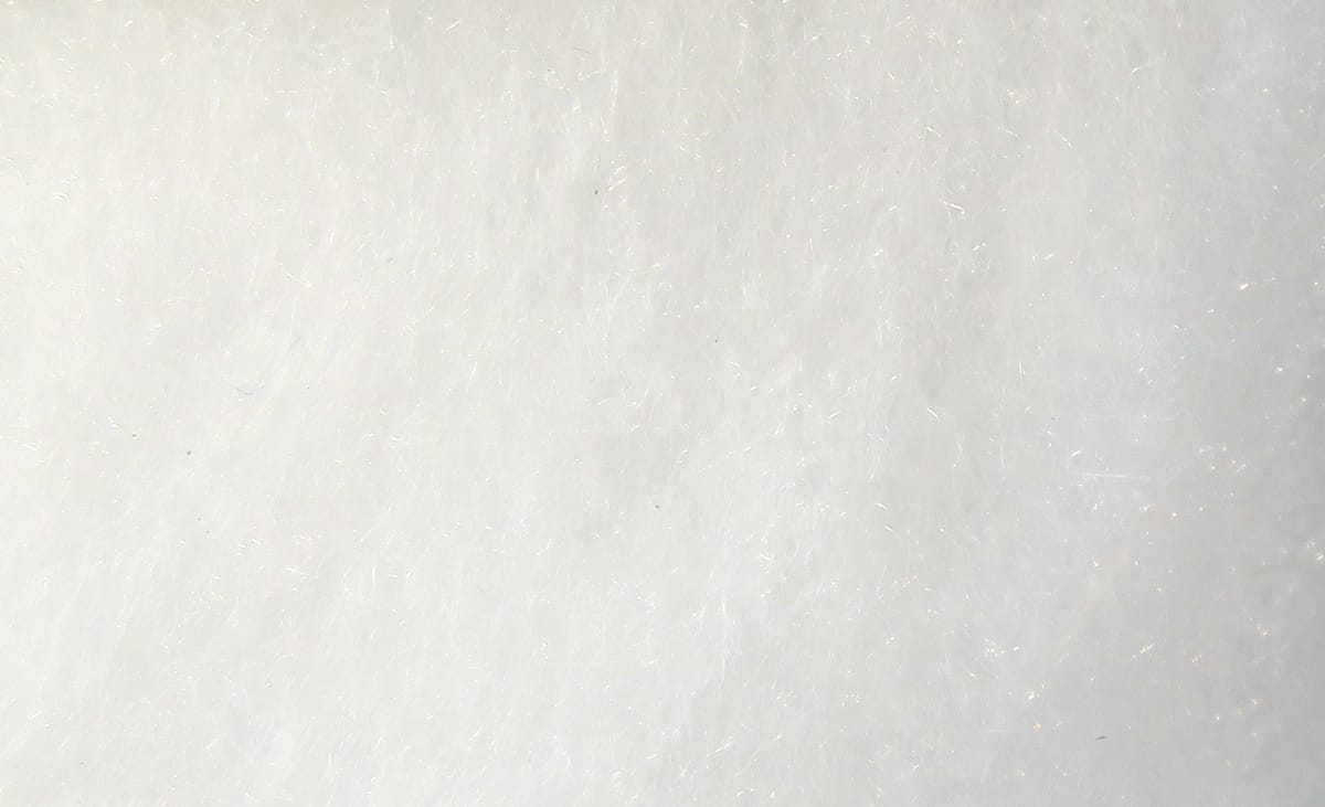 White Hareline super fine dry fly dubbing, soft synthetic fibrous texture with fine sparkle for fly tying