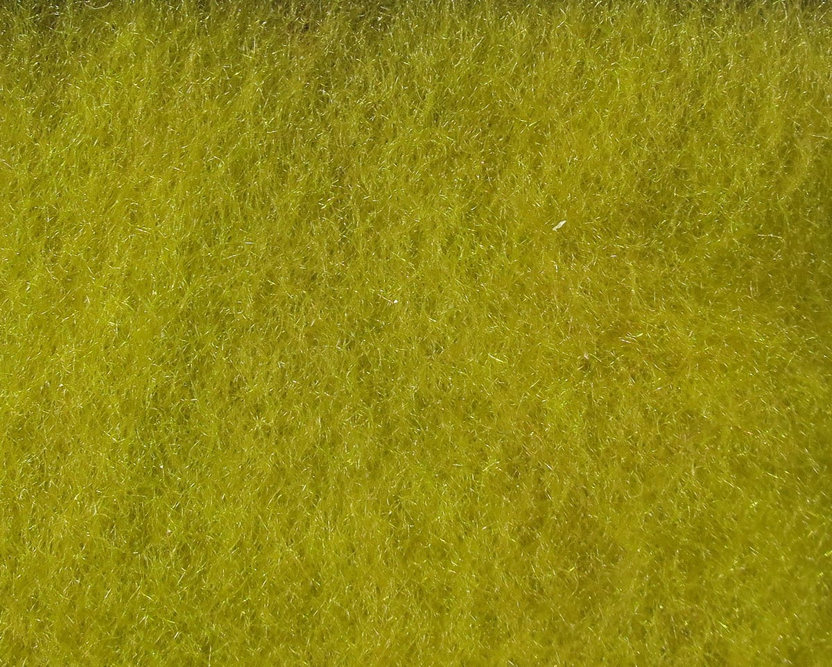 Olive chartreuse Hareline super fine dry fly dubbing—fuzzy synthetic fibers with subtle iridescent strands for fly tying.