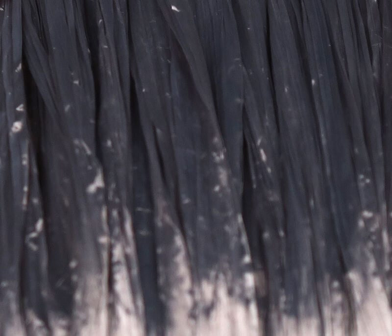 Dark charcoal Hareline Swiss Straw synthetic flat strands with glossy ribbed texture for fly tying