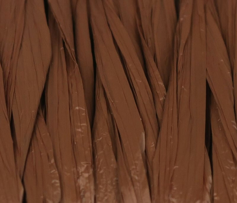 Brown Hareline Swiss Straw synthetic flat strips for fly tying, glossy narrow folded straw fibers with smooth texture.