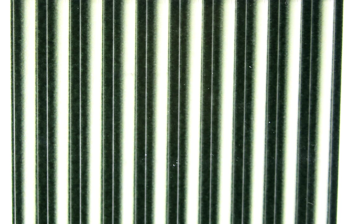 Glossy olive-green and white tapered synthetic quills in parallel strips for fly tying
