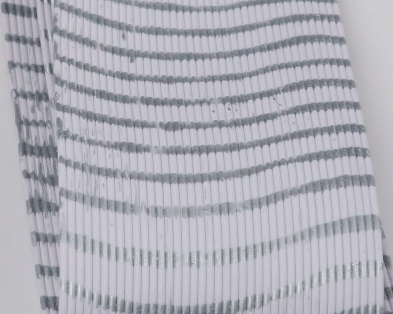 Hareline Tarantu-Leggs white segmented synthetic legs with silver-gray ribbed stripes, soft flexible fly tying material