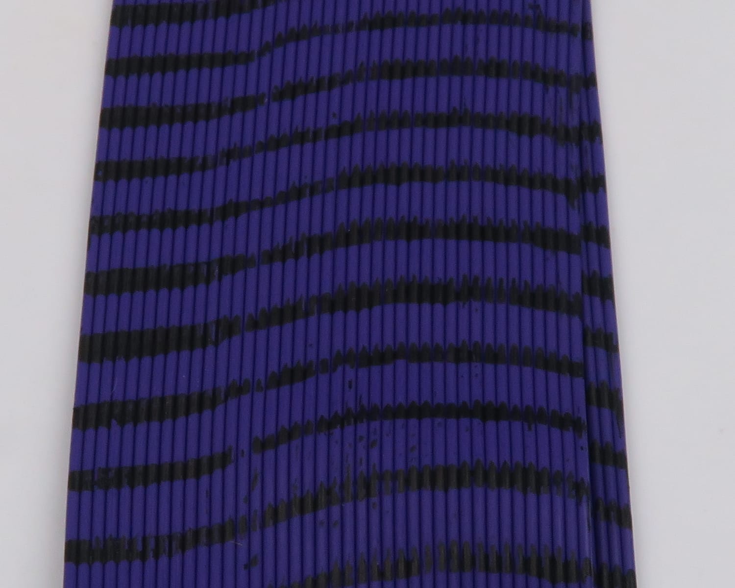 Purple and black striped silicone tarantul-legs for fly tying, ribbed segmented texture