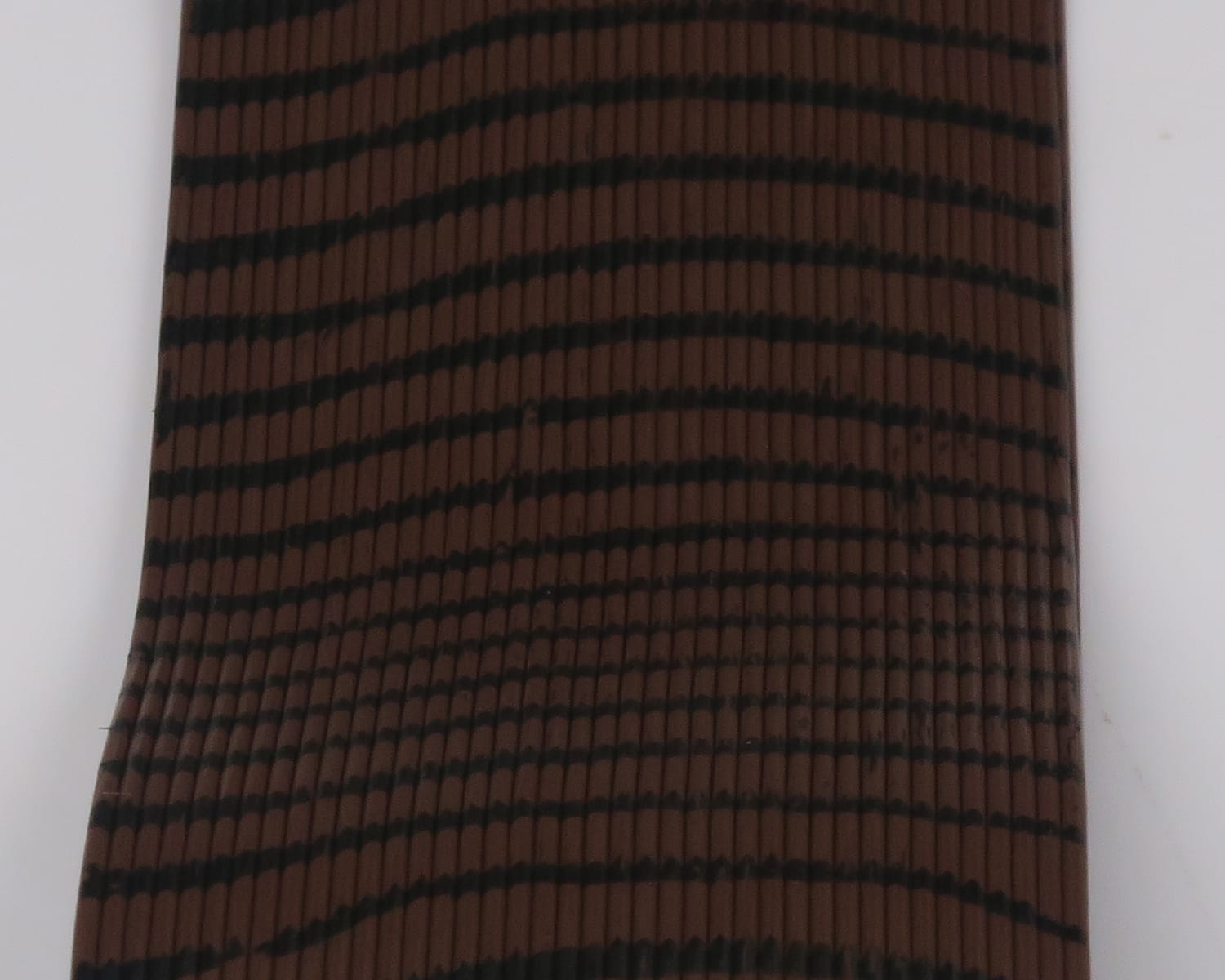 Hareline Tarantu-Leggs brown ribbed synthetic fly-tying legs with thin black horizontal banding and textured ridges