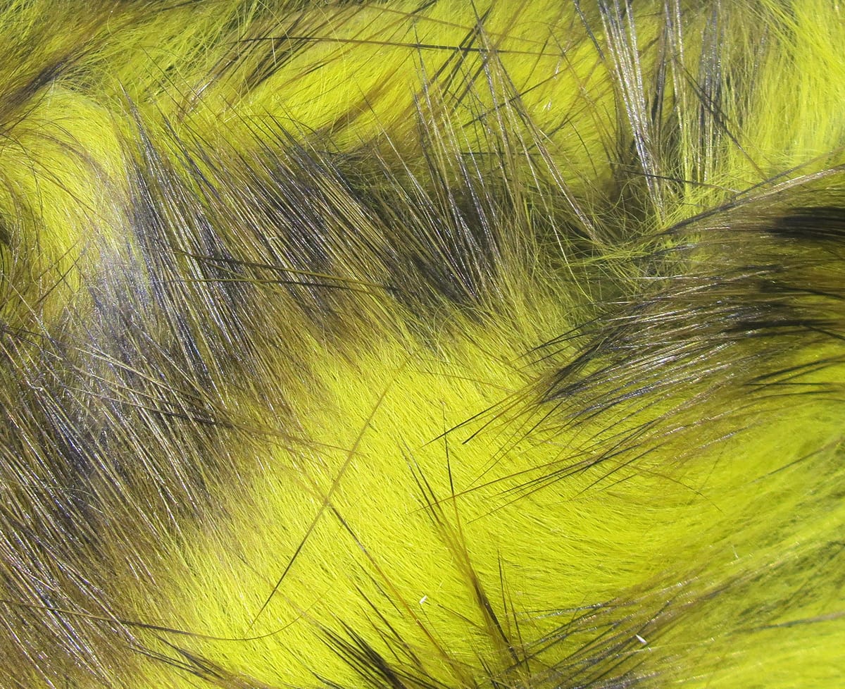Chartreuse and black barred rabbit fur strips with long guard hairs, soft dense underfur for fly tying