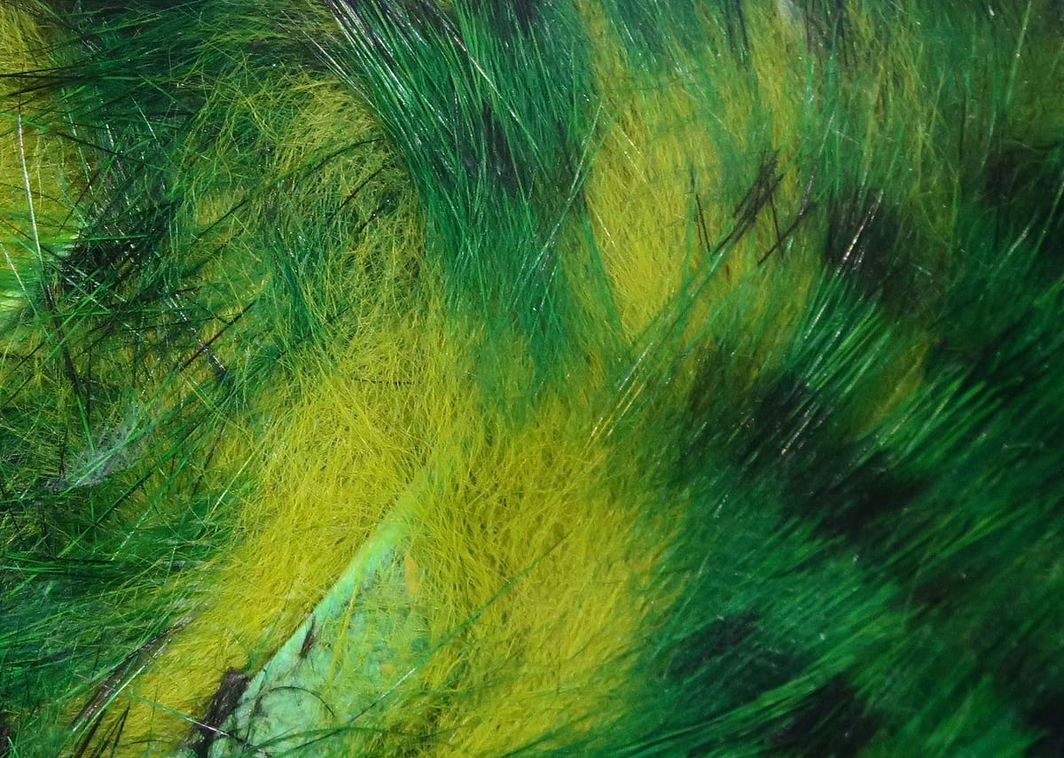 Green and yellow Hareline tiger barred rabbit fur strips with long glossy guard hairs and soft underfur for fly tying