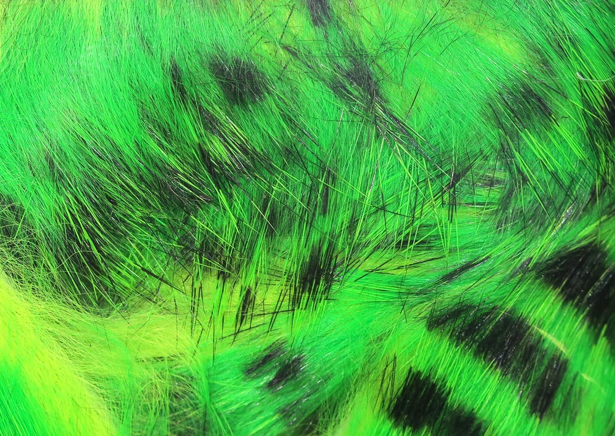 Neon green tiger-barred rabbit fur strips with bold black bars, soft long fibers for fly tying