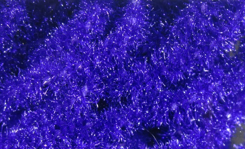 Deep violet trilobal Antron chenille fibers for fly tying with sparkly, iridescent, fuzzy texture