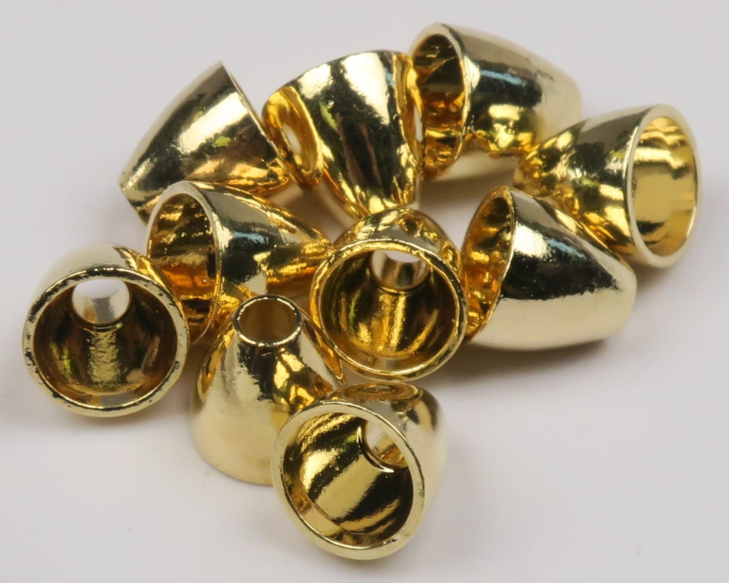 Shiny gold tungsten cone heads for fly tying, tapered metallic cones with center holes