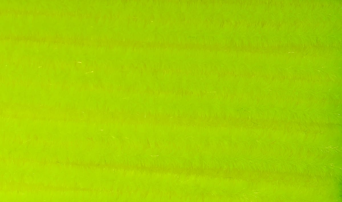 Fluorescent chartreuse fuzzy chenille with soft hairy texture and ribbed strands for fly tying