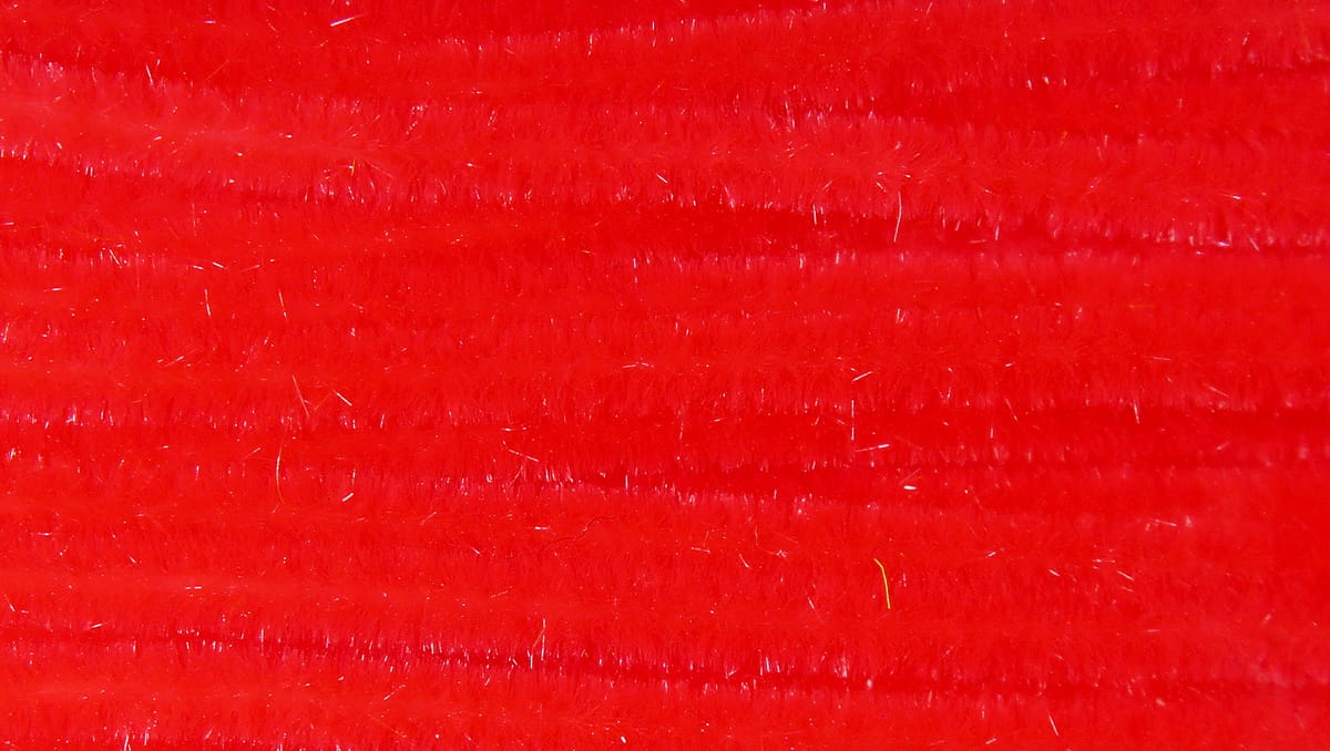 Bright red ultra chenille with soft fuzzy pile and subtle iridescent strands for fly tying
