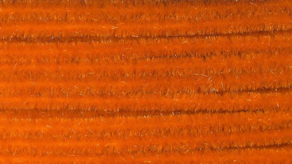 Hareline Ultra Chenille bright orange fly-tying chenille with dense fuzzy fibers and subtle silver flash