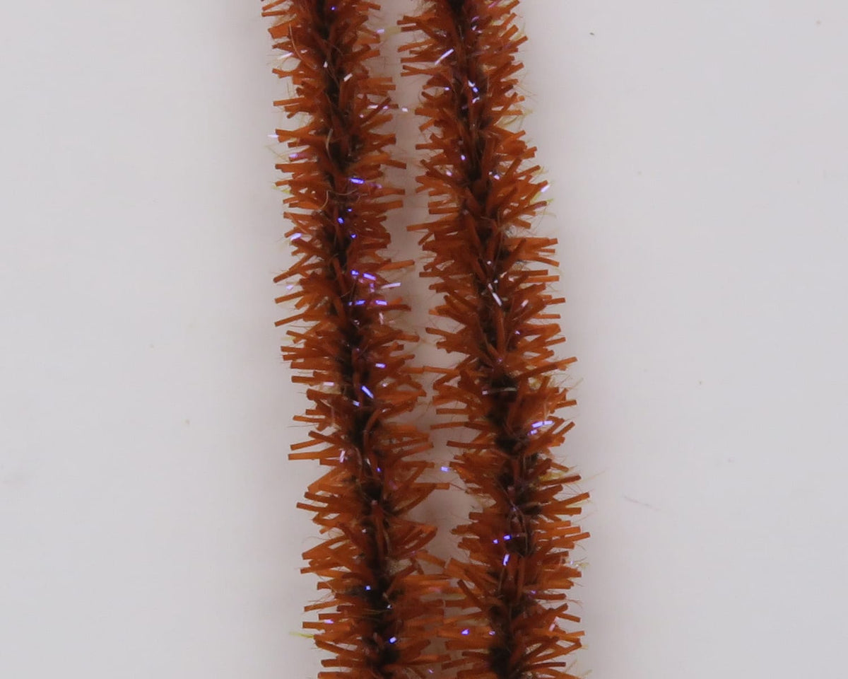 Rust-brown UV Badger Flexi squishenille chenille strands with purple iridescent tinsel for fly tying