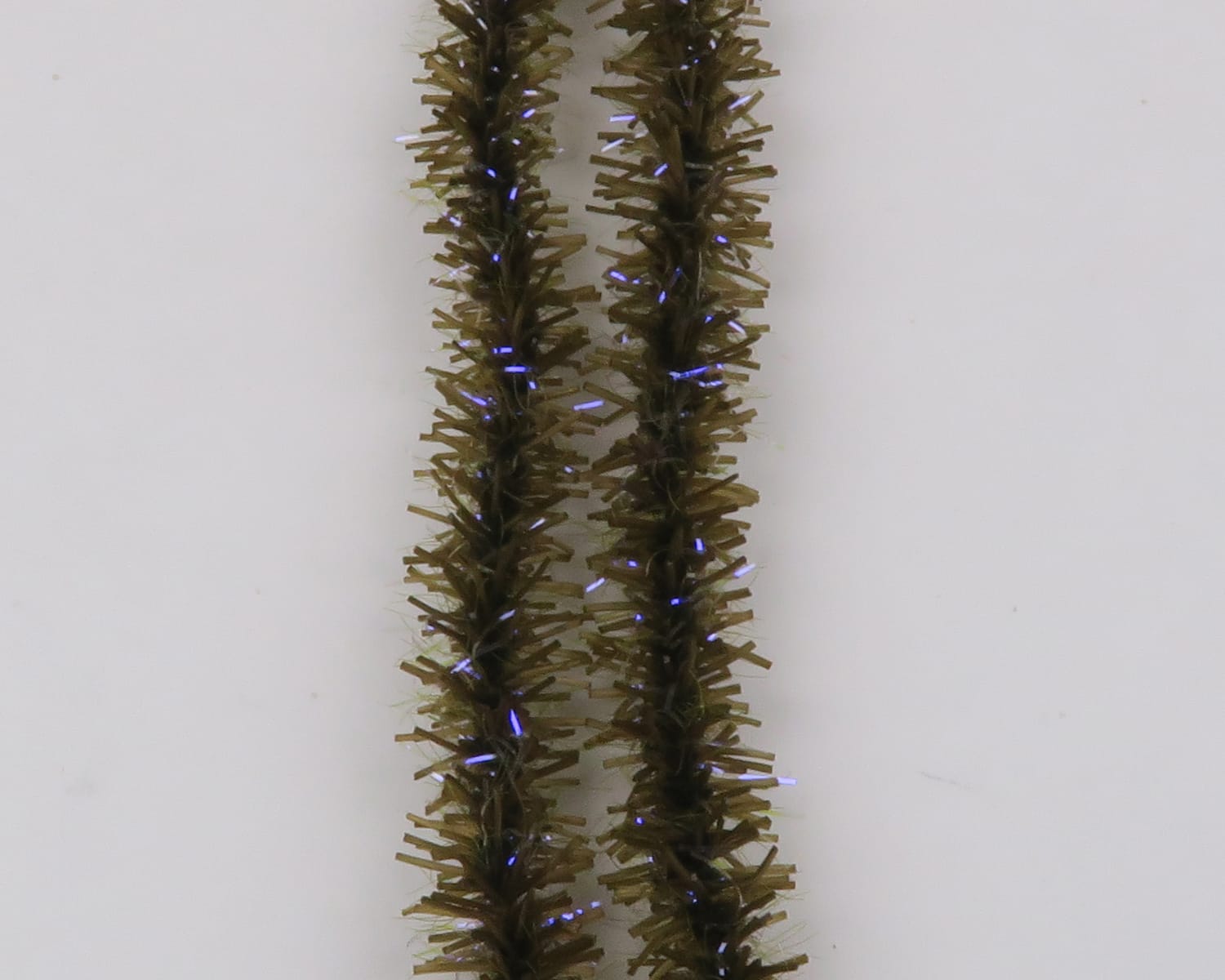 Olive brown Hareline UV Badger Flexi Squishenille chenille strands with iridescent blue flash fibers for fly tying