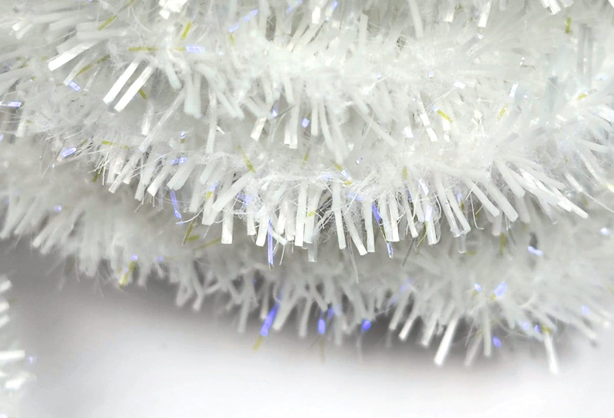 Close-up white UV Flexi Squishenille fly tying chenille with fluffy fibers and iridescent tinsel strands