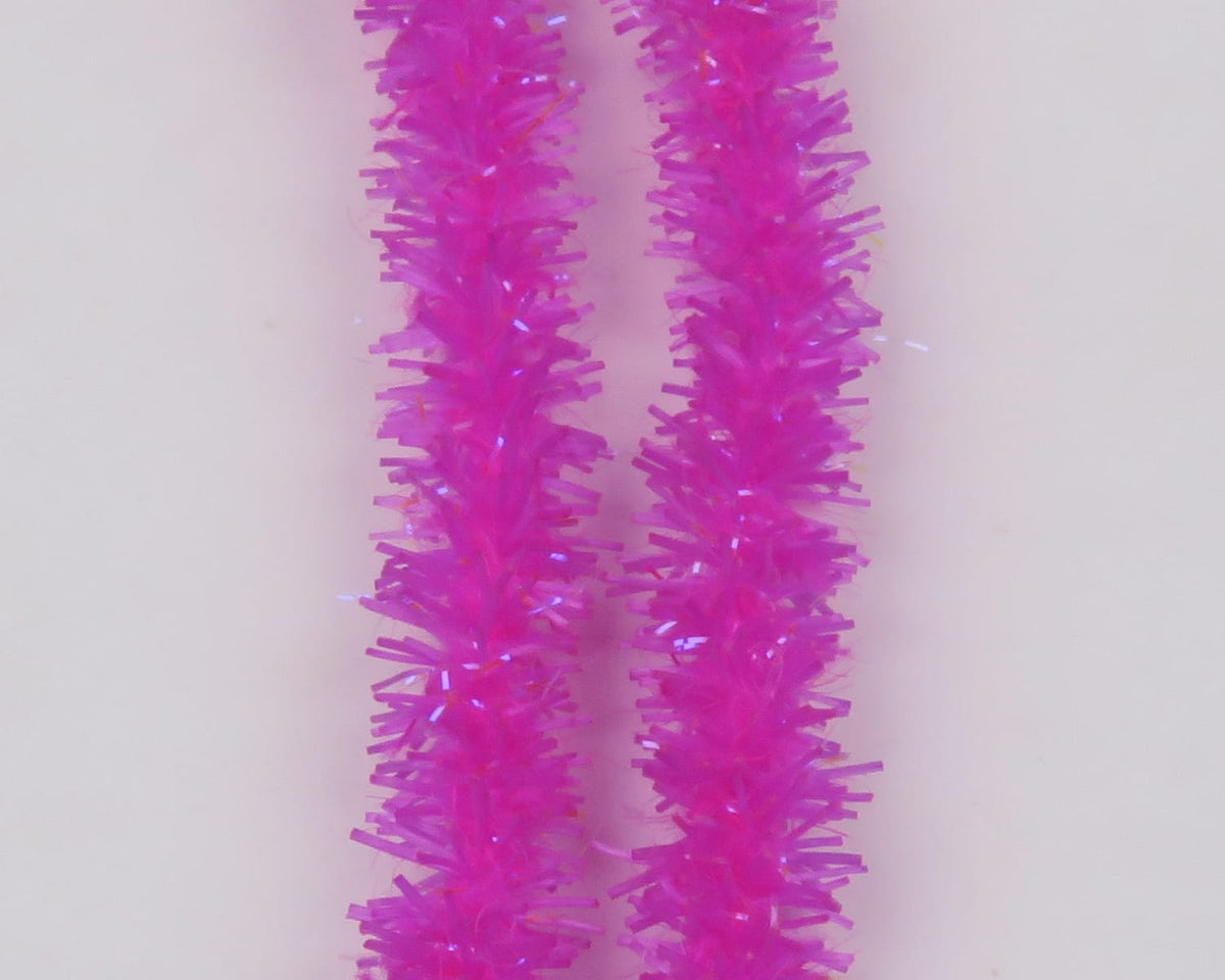 Bright hot pink Hareline UV Flexi Squishenille chenille strands with iridescent tinsel and fuzzy brush texture for fly tying