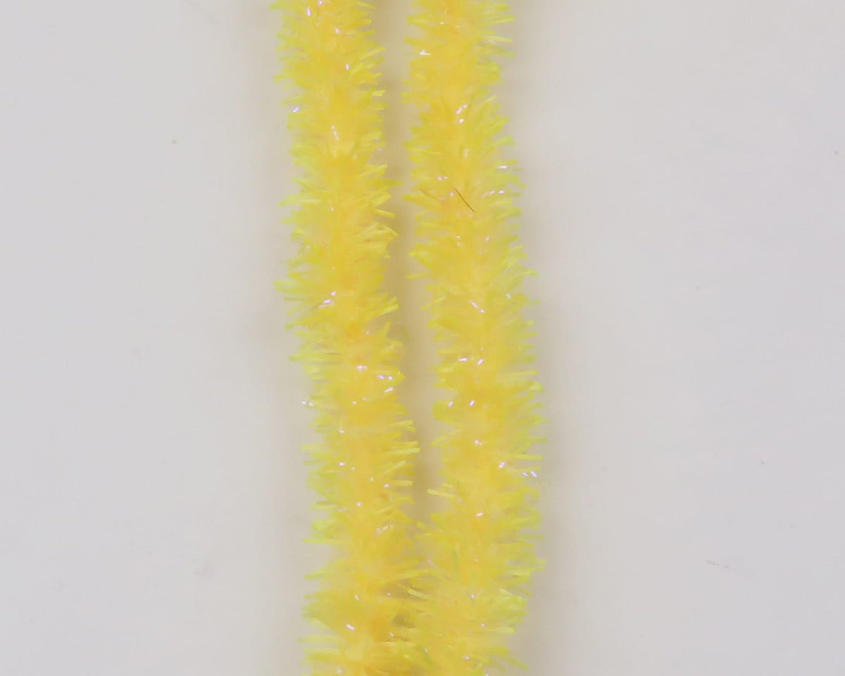 Bright yellow Hareline UV Flexi Squishenille strands with iridescent tinsel, soft fuzzy chenille for fly tying