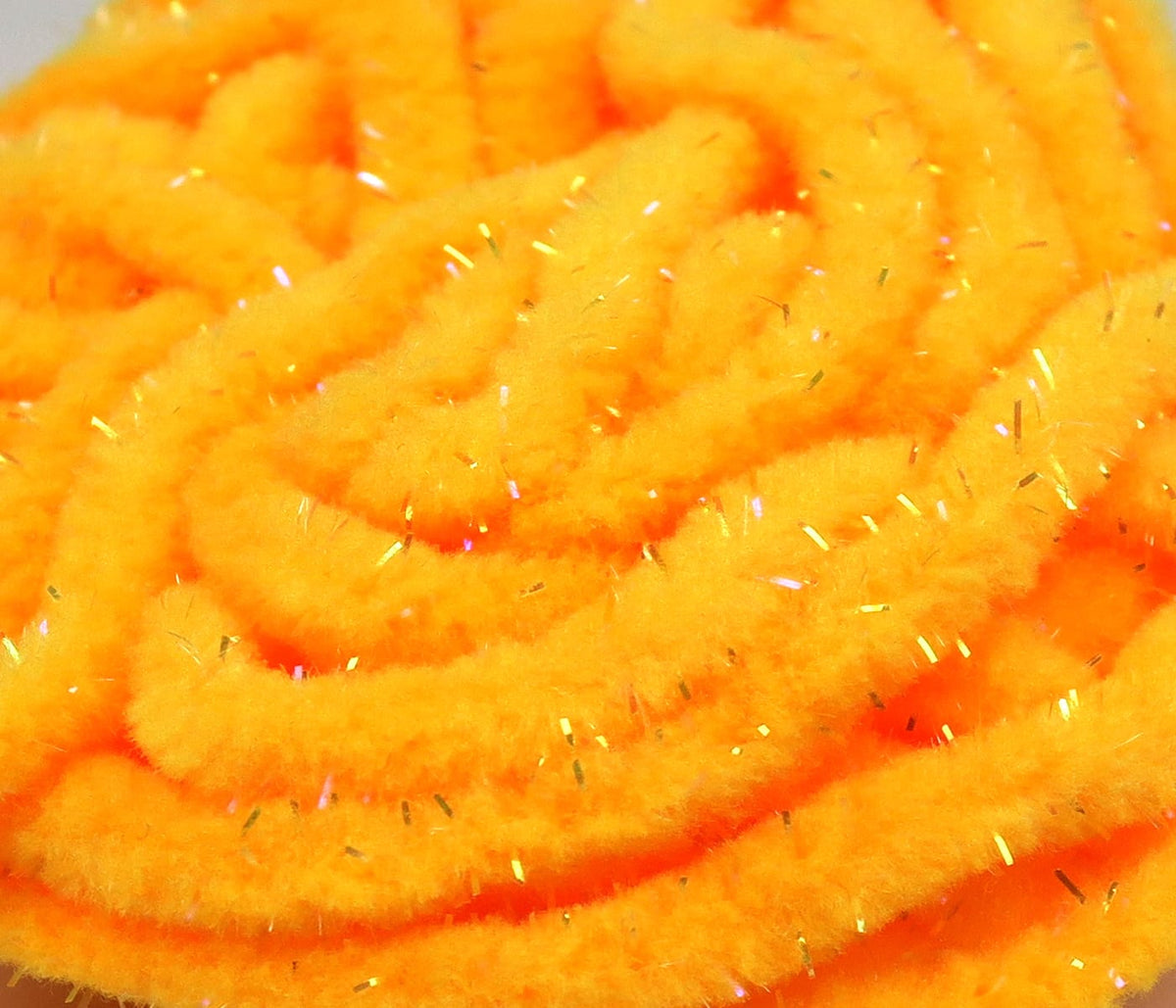 Bright UV orange mop chenille with fluffy plush fibers and iridescent tinsel strands for fly tying