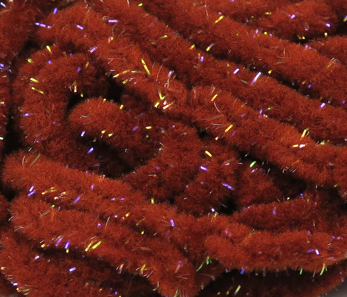 Hareline UV Galaxy mop chenille in deep rust red, fluffy synthetic yarn with iridescent tinsel flecks for fly tying