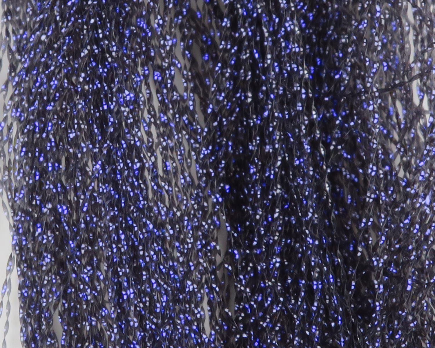 Hareline UV Krystal Flash fly tying material: black twisted synthetic strands with electric blue iridescent sparkle