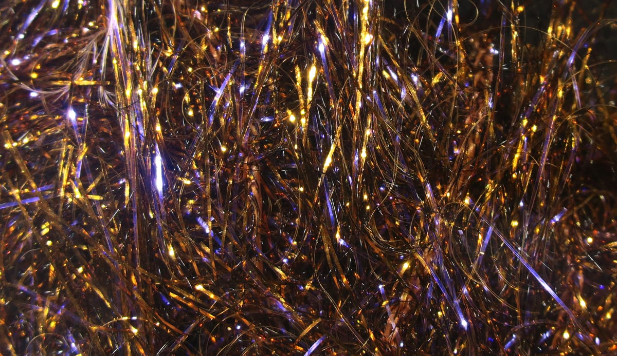 Hareline UV polar chenille with iridescent copper, purple and gold metallic fibers, shimmering synthetic tinsel for fly tying