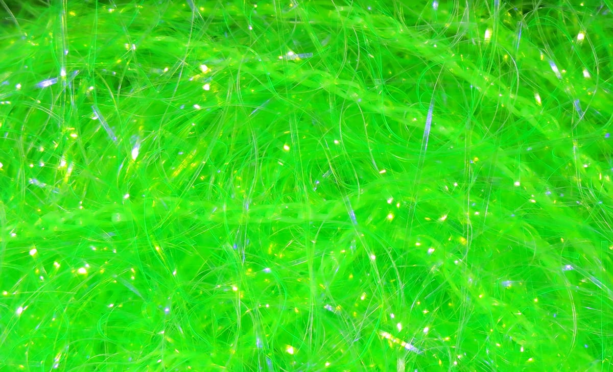 Bright chartreuse Hareline UV polar chenille — fluffy synthetic fibers with iridescent tinsel strands for fly tying