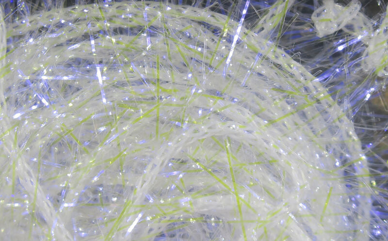 Hareline UV chenille pearly white with iridescent blue shimmer and thin chartreuse strands, sparkly synthetic material