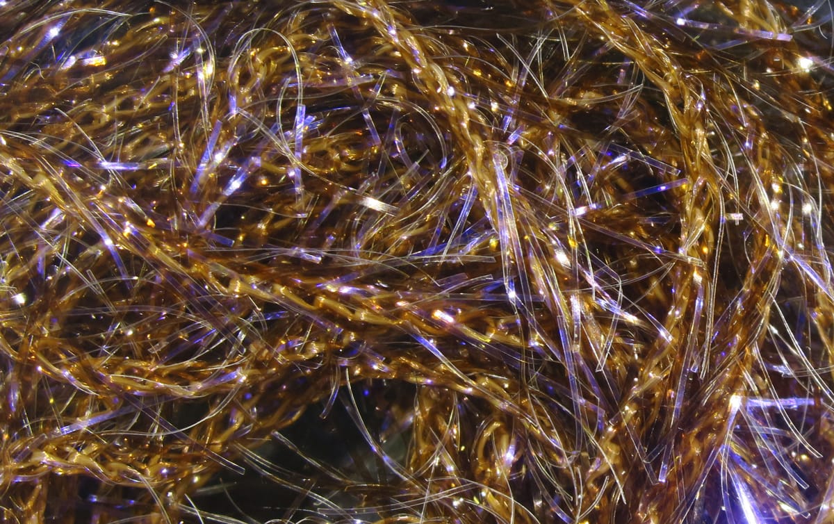 Hareline UV Polar chenille in tangled copper-gold metallic fibers with iridescent purple flashes for fly tying