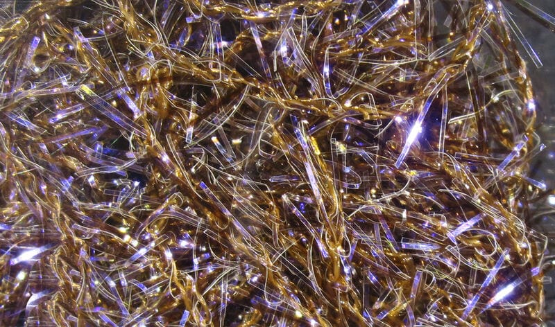 Hareline UV Polar Chenille strands: gold twisted core with iridescent purple-blue tinsel fibers, sparkly synthetic fly tying